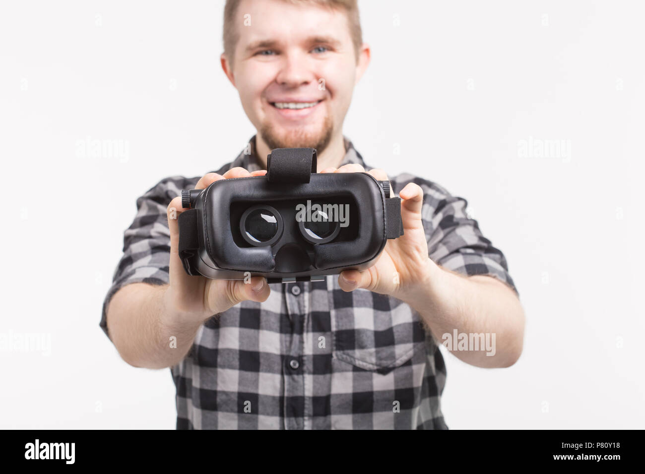 Man wearing virtual reality goggles on white background Stock Photo - Alamy