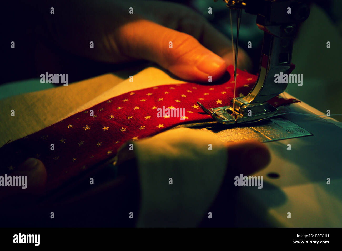 Sewing machine repairs are fabric in industry Stock Photo Alamy