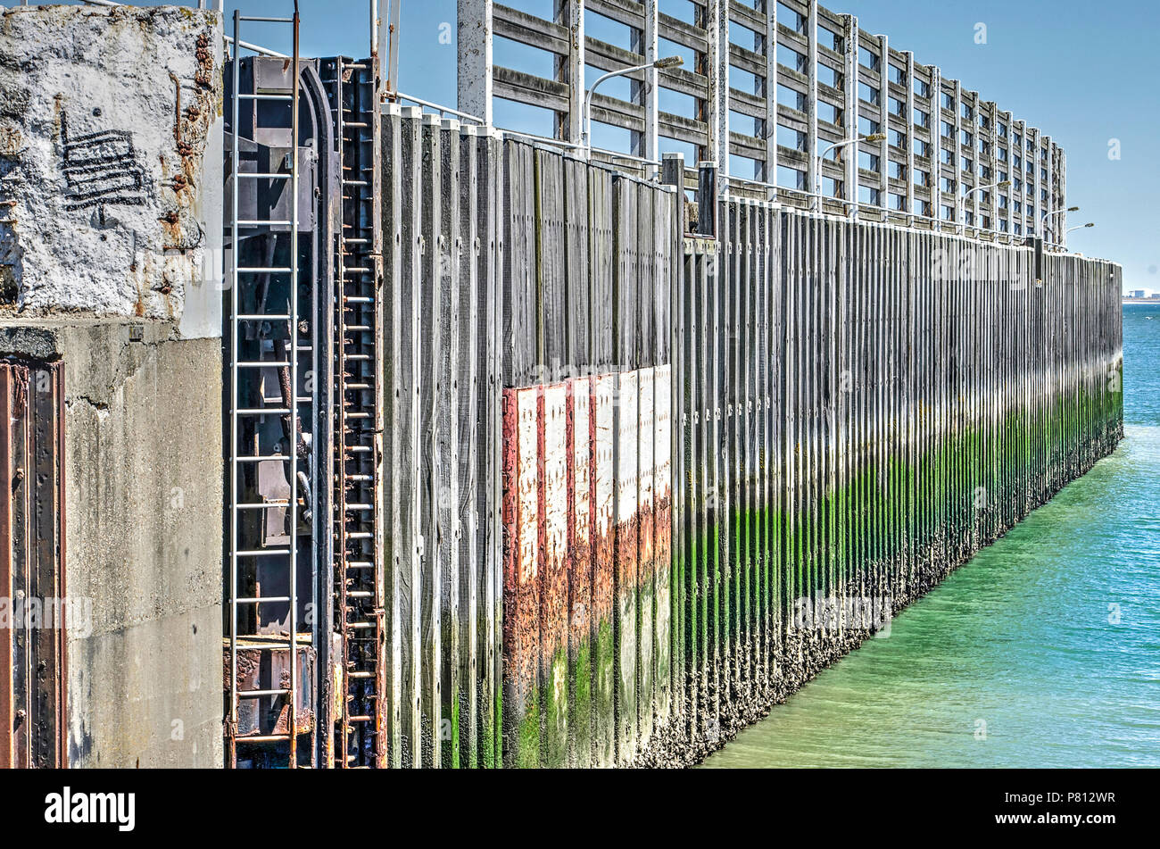 Elements of concrete, steel and wood in the quay wall of the feery