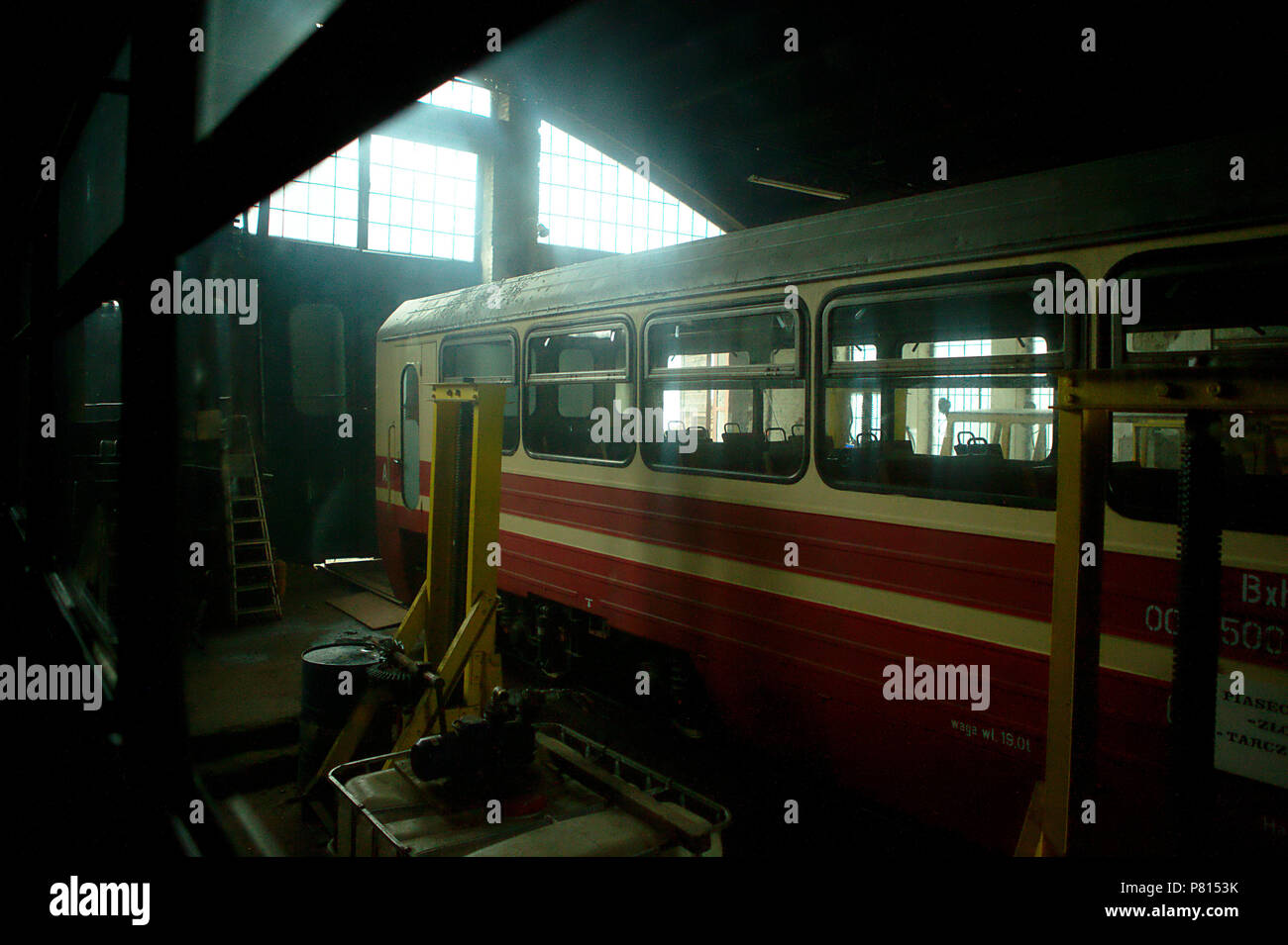old train in dark workshop, backlight Stock Photo