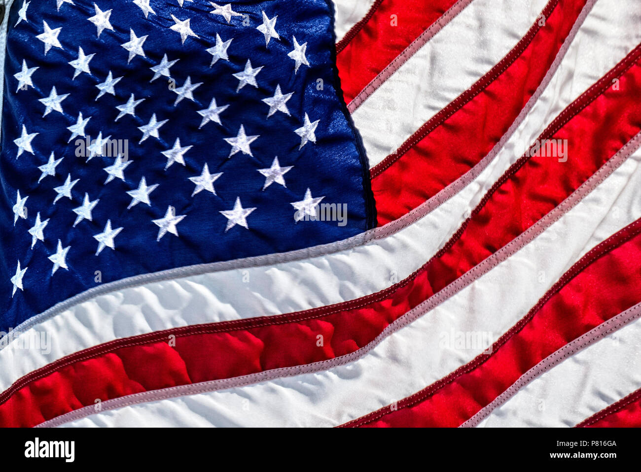 American flag flying in the wind Stock Photo