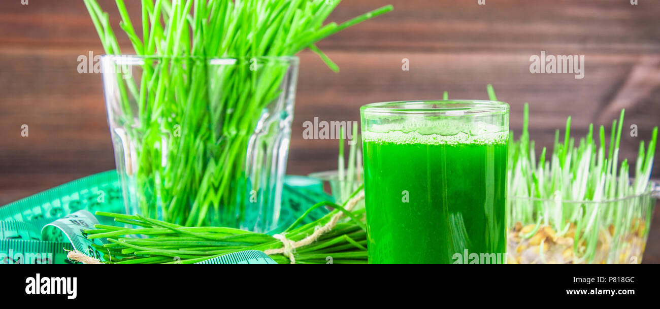 Wheatgrass shot. Juice from wheat grass. Trend of health Stock Photo