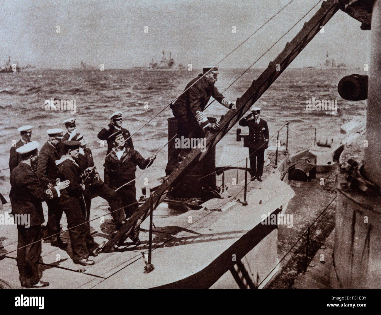 During 1917 - 1918, the Royal navy was mainly engaged in anti U-Boat activities.  King George V is seen here paying a visit to a British submarine Stock Photo