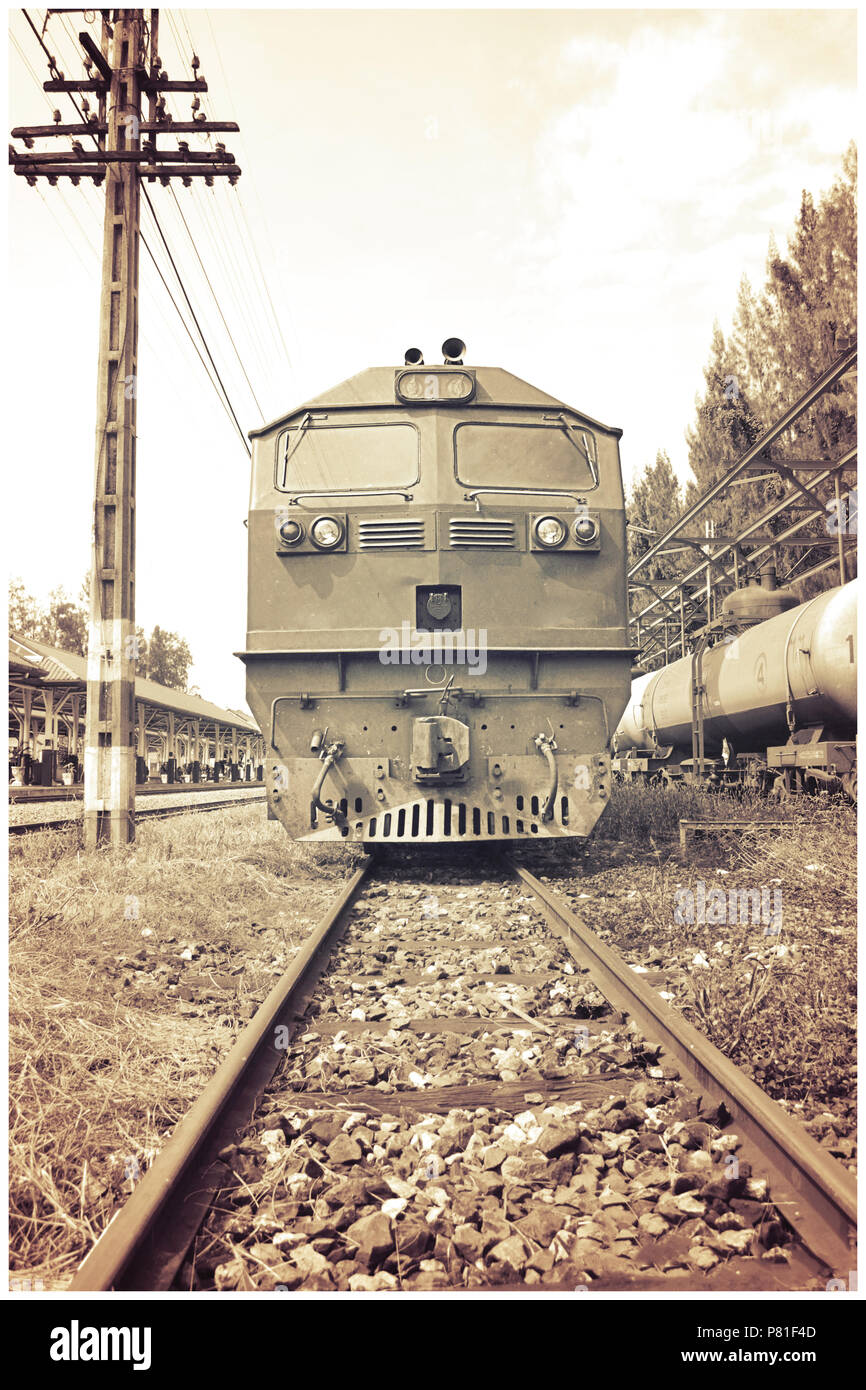 Retro train running on the rails with vintage color Stock Photo - Alamy