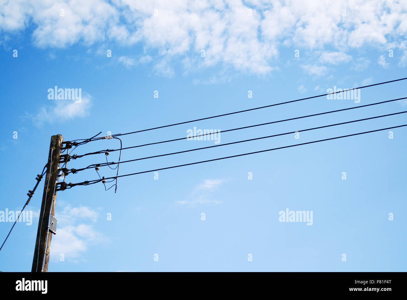 Electricity poles and wires with blue sky Stock Photo - Alamy