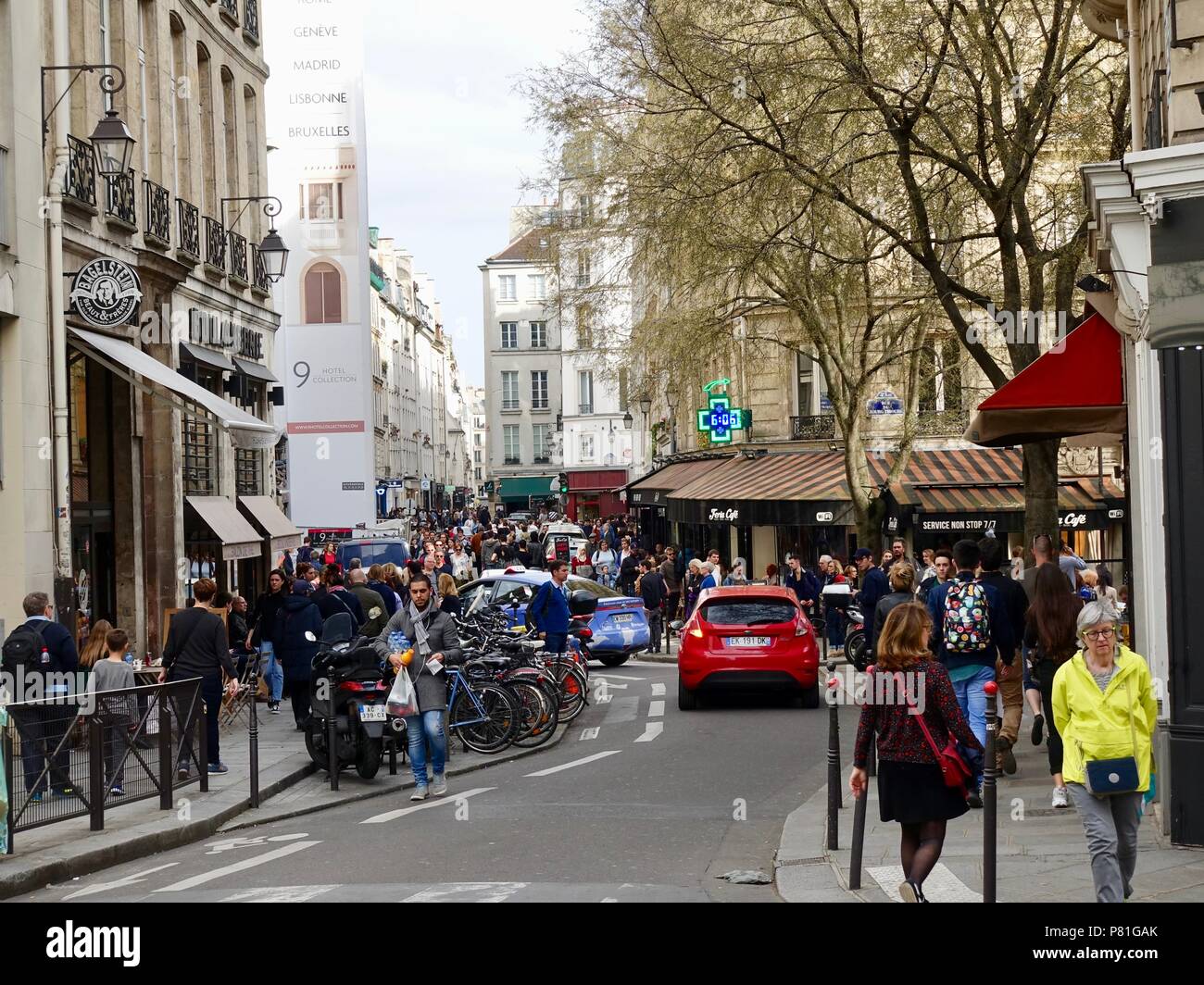 People crowd the Marais on rue de la Verrerie, on a Saturday evening in early April, Paris, France. Stock Photo
