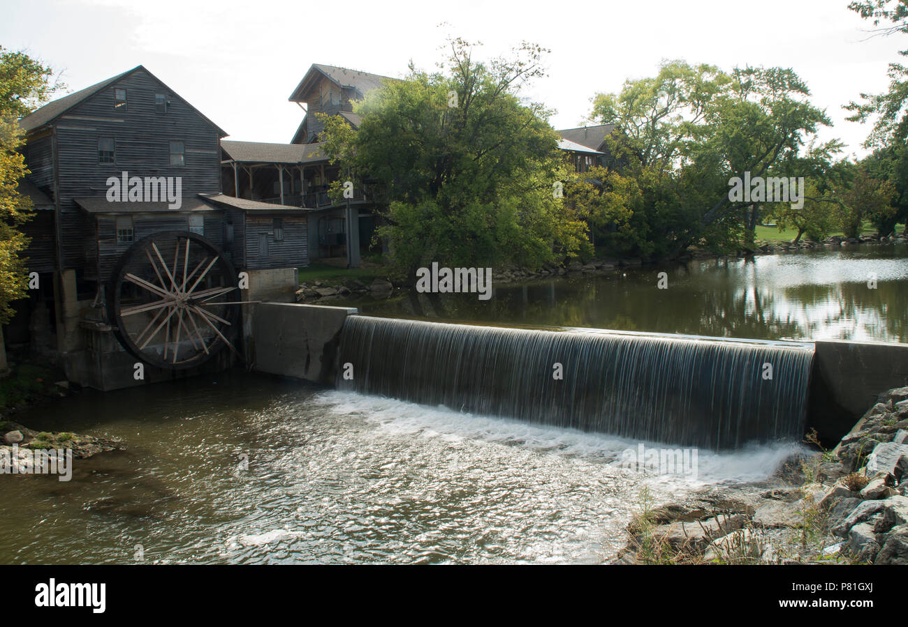 The Little Pigeon River flows by an old grain mill in Pigeon Forge Tn Stock Photo