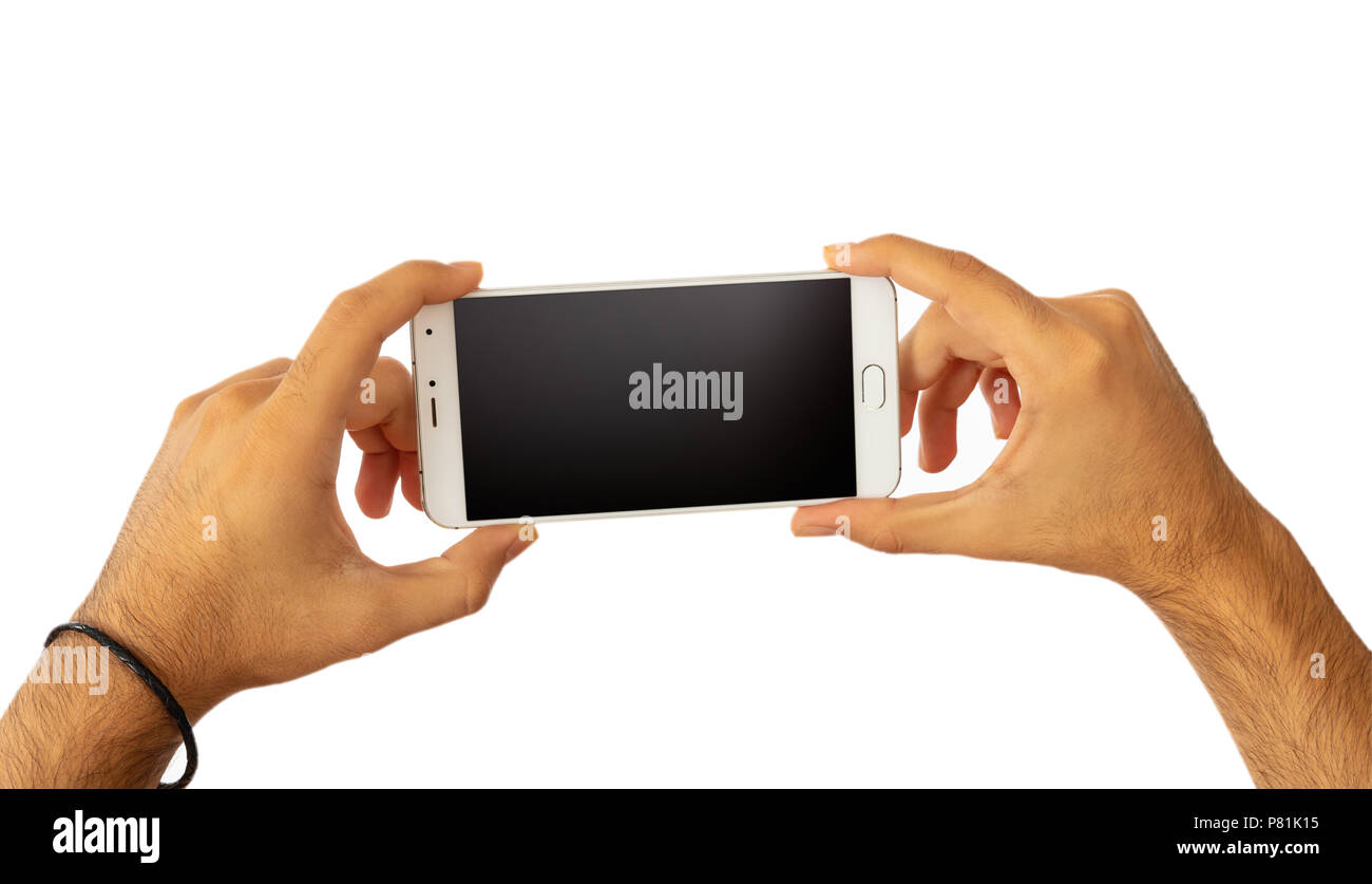 Male hands holding a smartphone with blank black screen isolated on ...