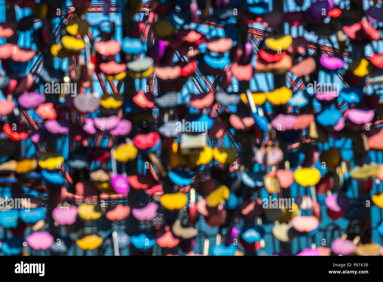 Lovers' padlocks left of Forth Road Bridge (Forth Bridge just visible in background), Summer 2018. Stock Photo