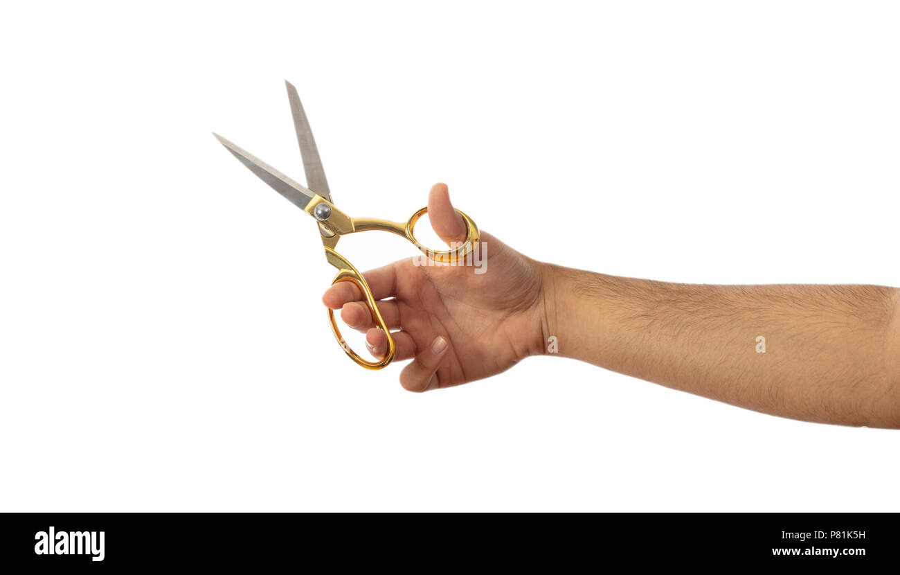 Beauty salon. Scissors in a male hand isolated on white background, clipping path Stock Photo