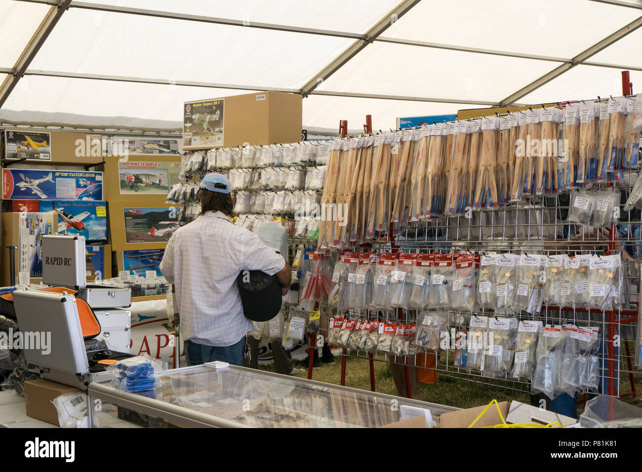 Customer perusing goods for sale at Wings and Wheels Stock Photo