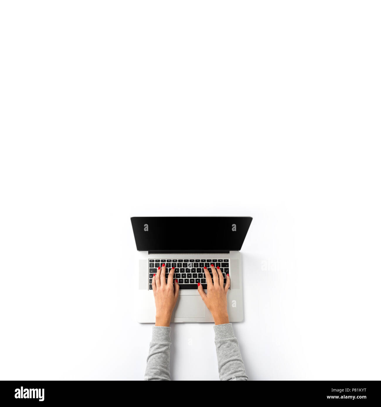 Woman working on laptop over white background Stock Photo