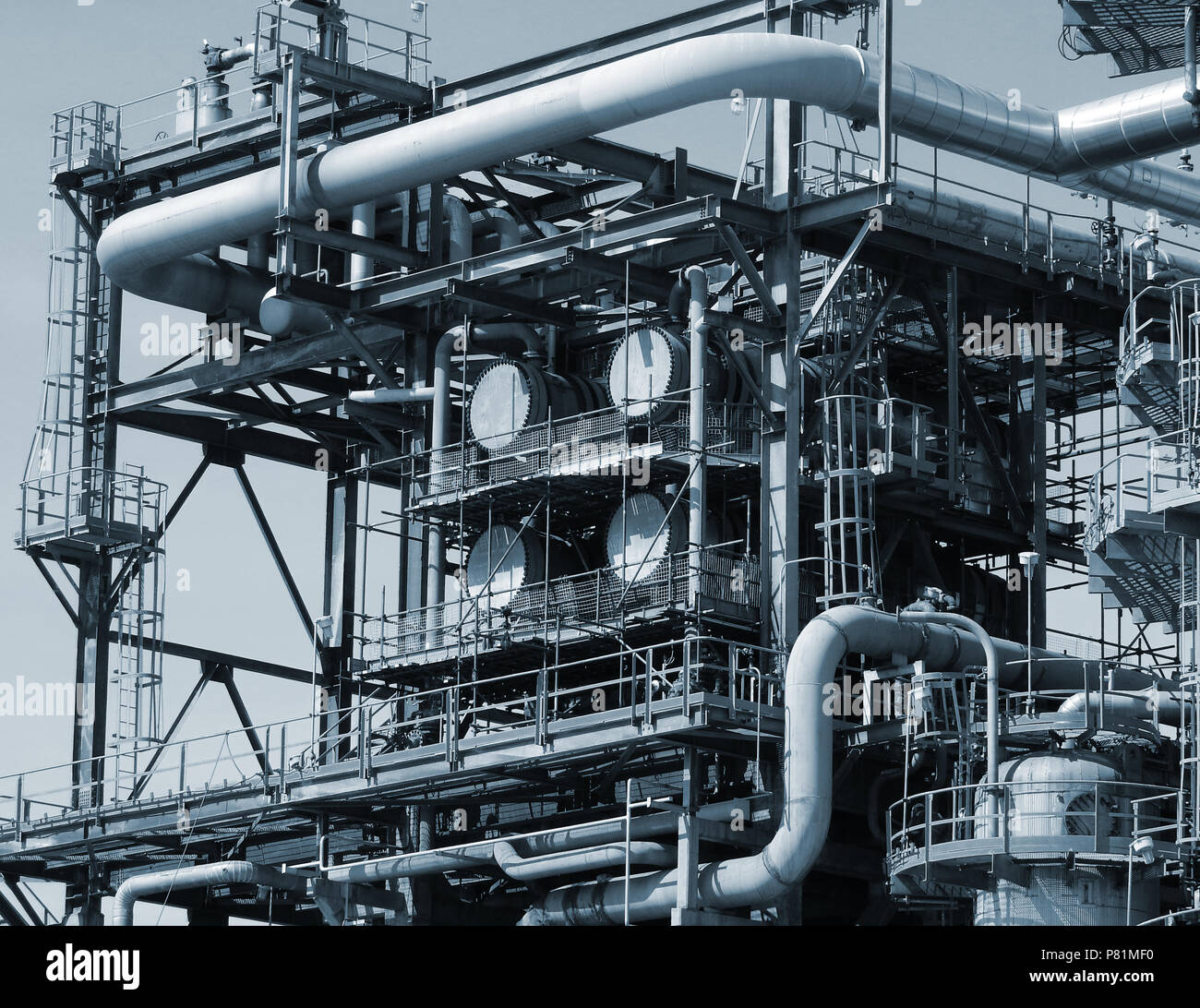 Pipelines and towers view of oil and gas refinery. Stock Photo