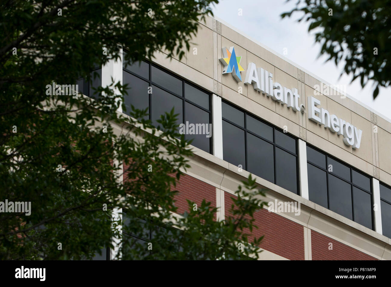 A logo sign outside of the headquarters of Alliant Energy in Madison