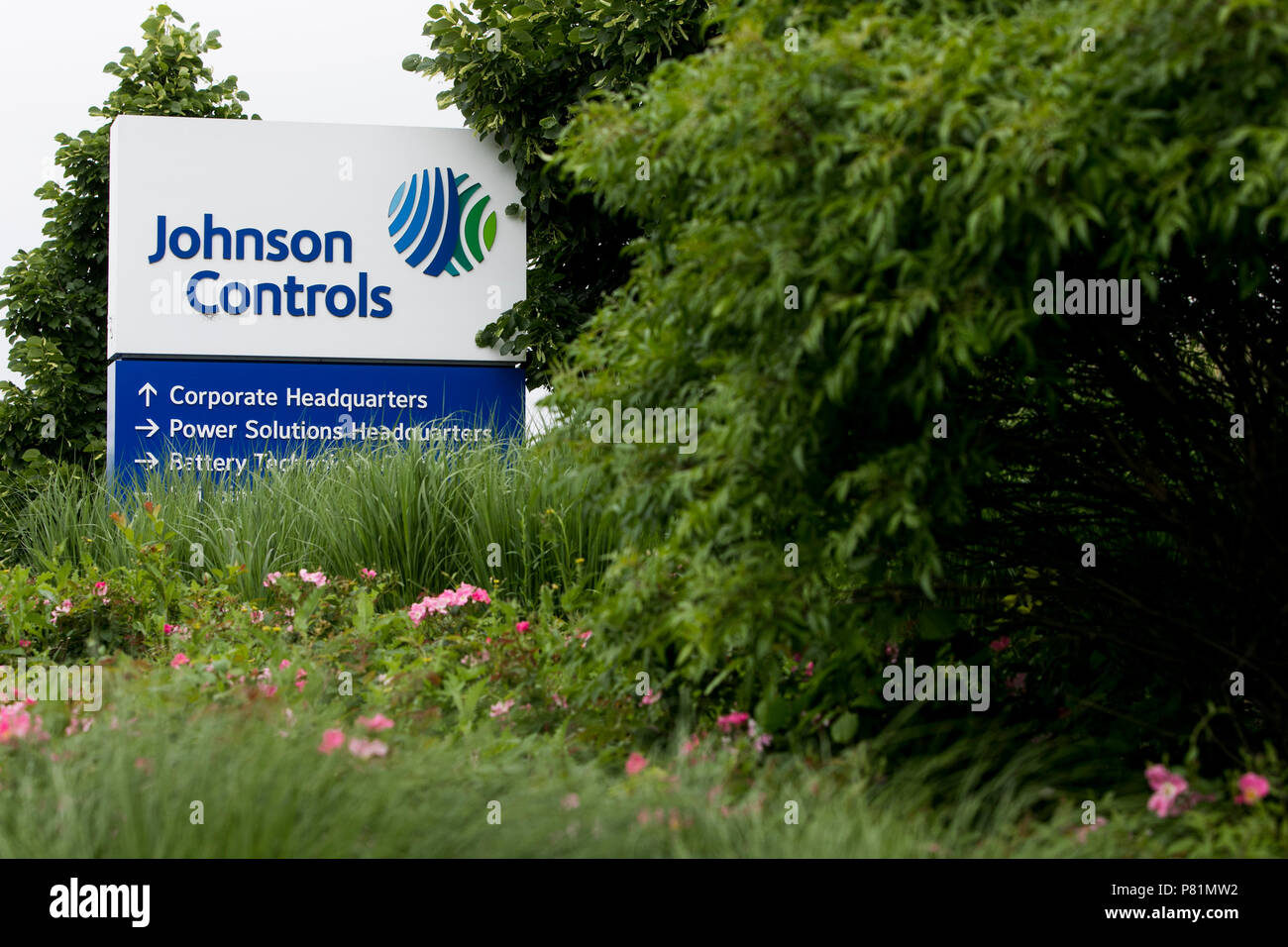 A logo sign outside of the headquarters of Johnson Controls in