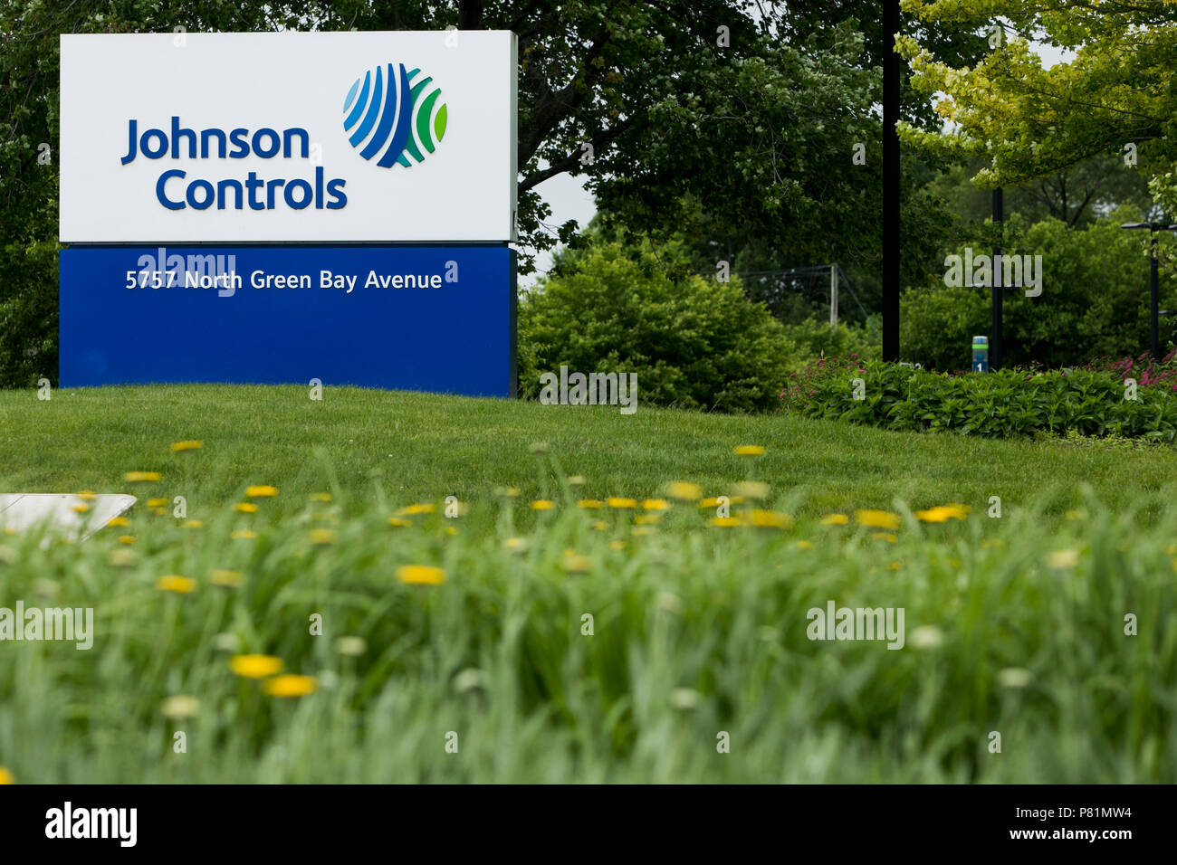 A logo sign outside of the headquarters of Johnson Controls in