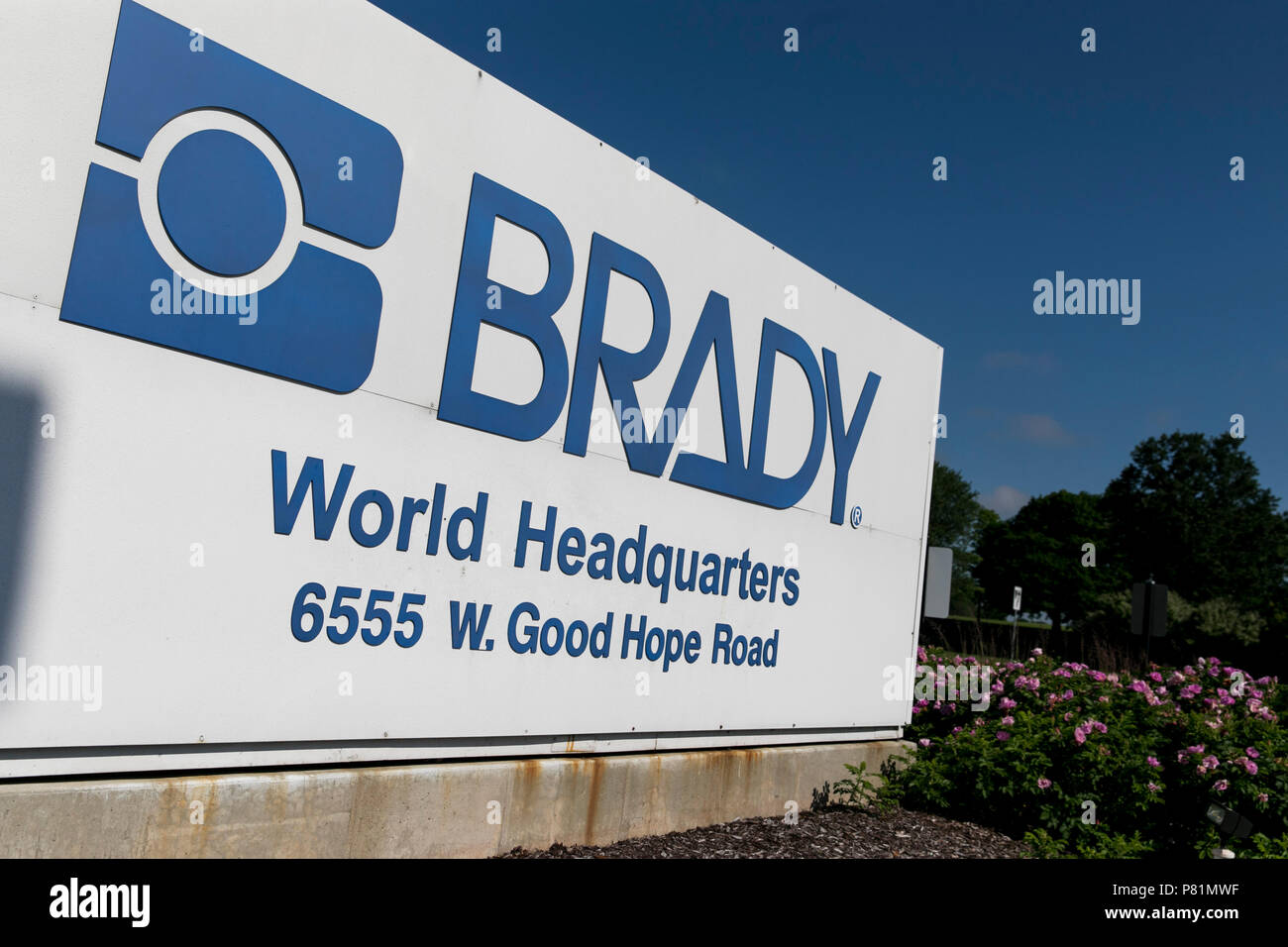 A logo sign outside of the headquarters of the Brady Corporation in