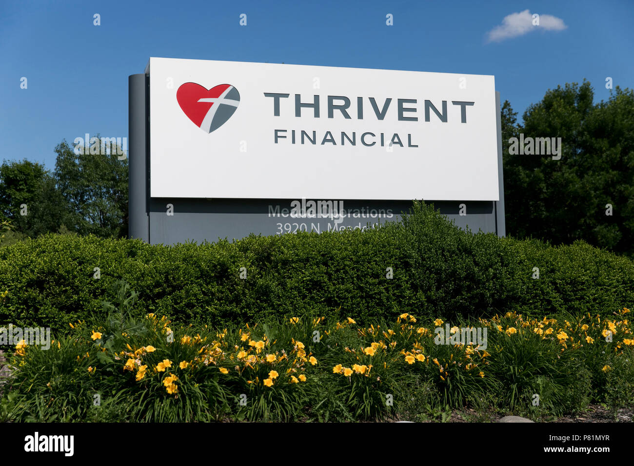 A logo sign outside of the headquarters of Thrivent Financial in