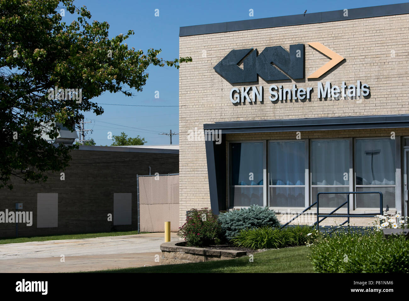 A logo sign outside of a facility occupied by GKN in Menomonee Falls
