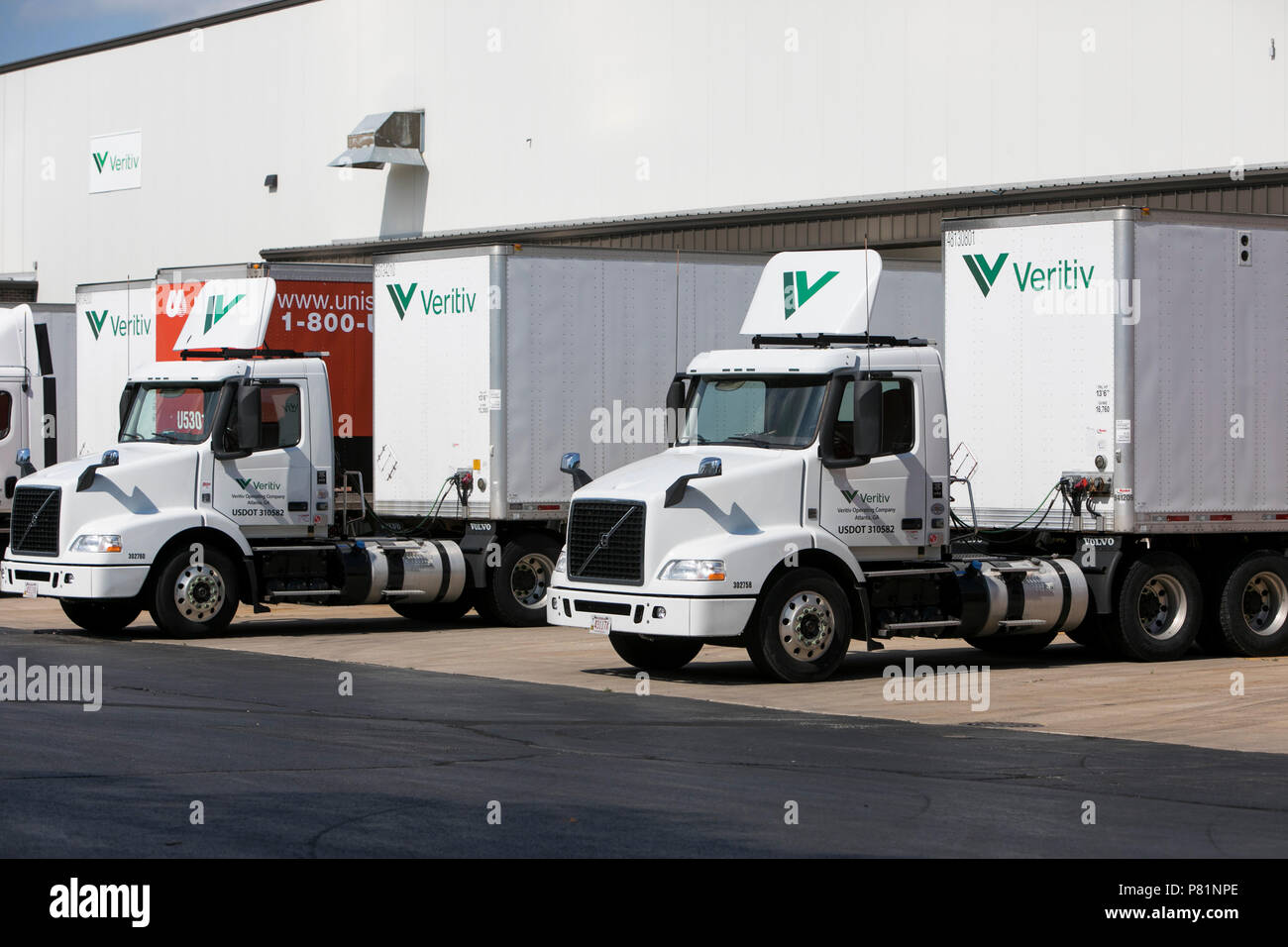 Semi-trucks and trailers featuring Veritiv Corporation logos outside of a facility in Appleton, Wisconsin, on June 24, 2018. Stock Photo