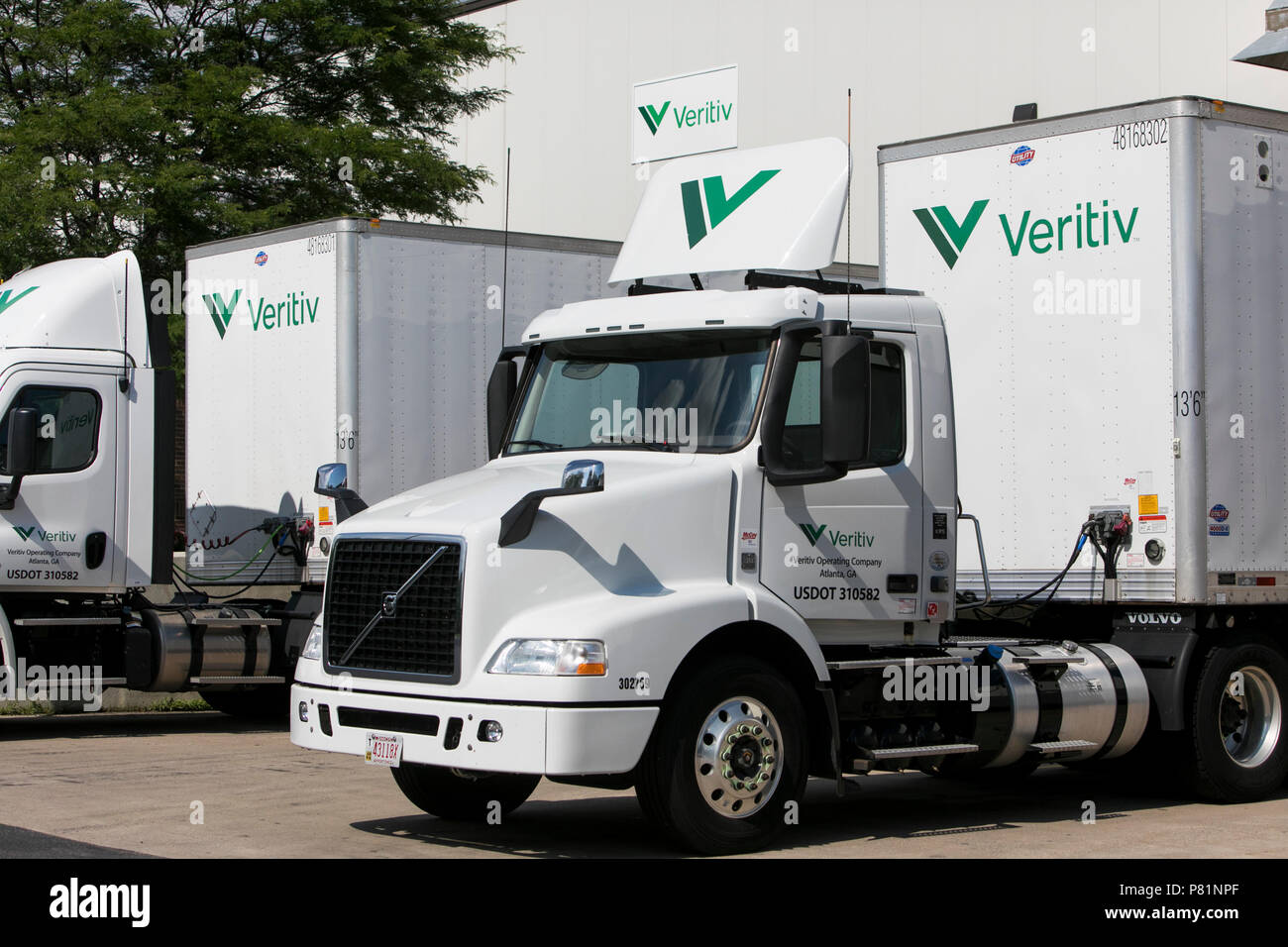 Semi-trucks and trailers featuring Veritiv Corporation logos outside of a facility in Appleton, Wisconsin, on June 24, 2018. Stock Photo