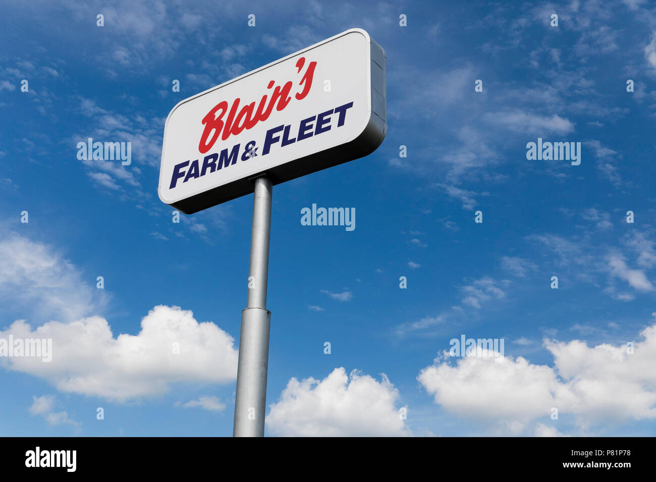 A logo sign outside of a Blain's Farm & Fleet retail store in