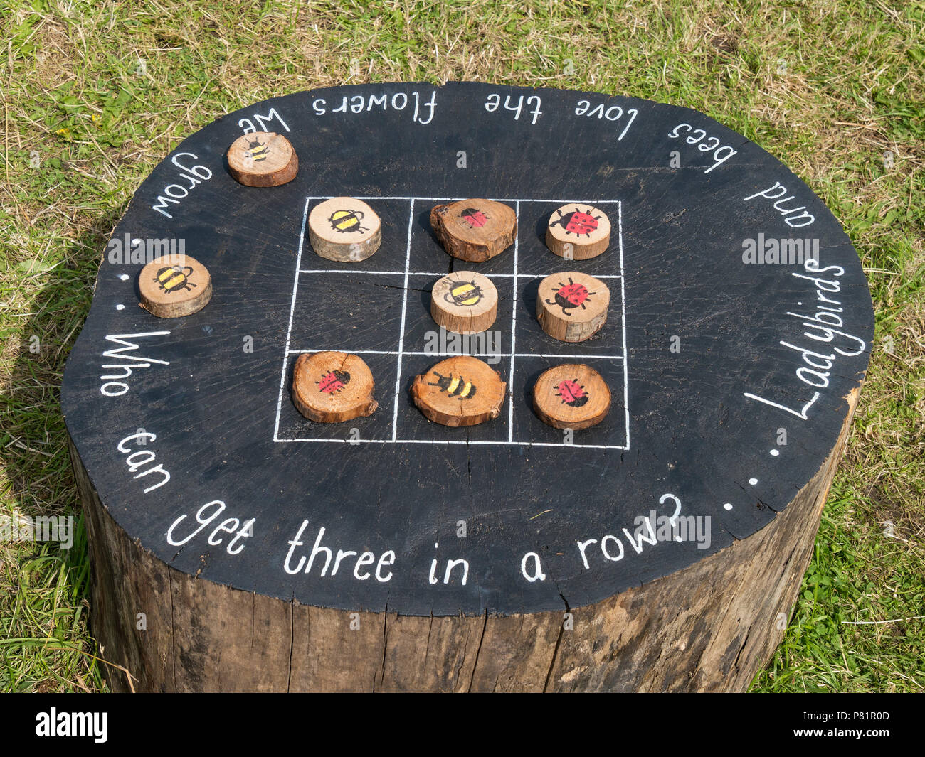 Children's large wildlife themed wooden outdoor tic tac toe game (noughts and crosses). Stock Photo