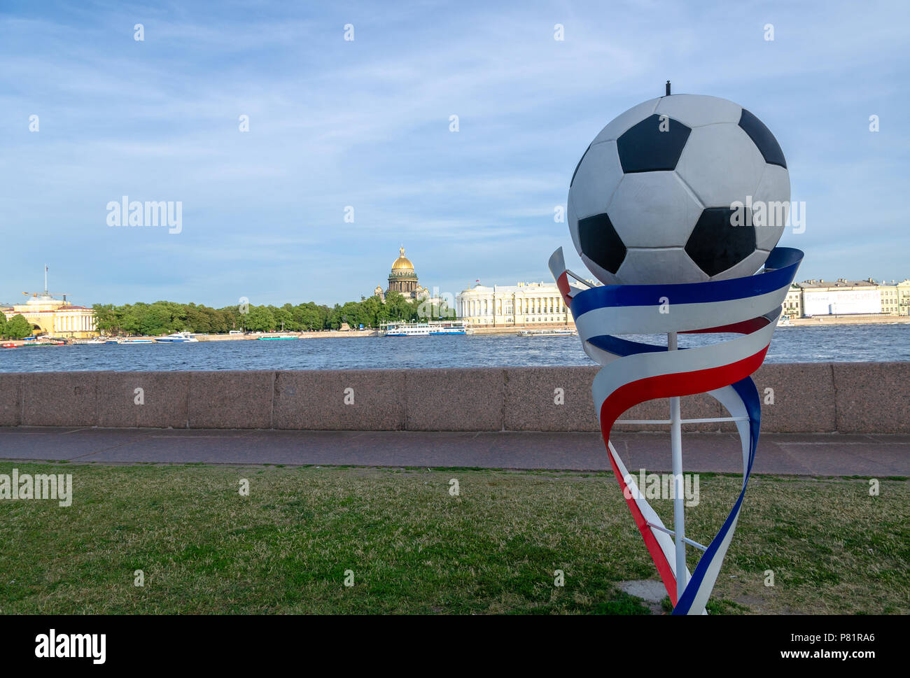 Football prop and Russian flag colours by the Neva river in St Petersburg to mark the FIFA World Cup 2018 held in the country. Stock Photo