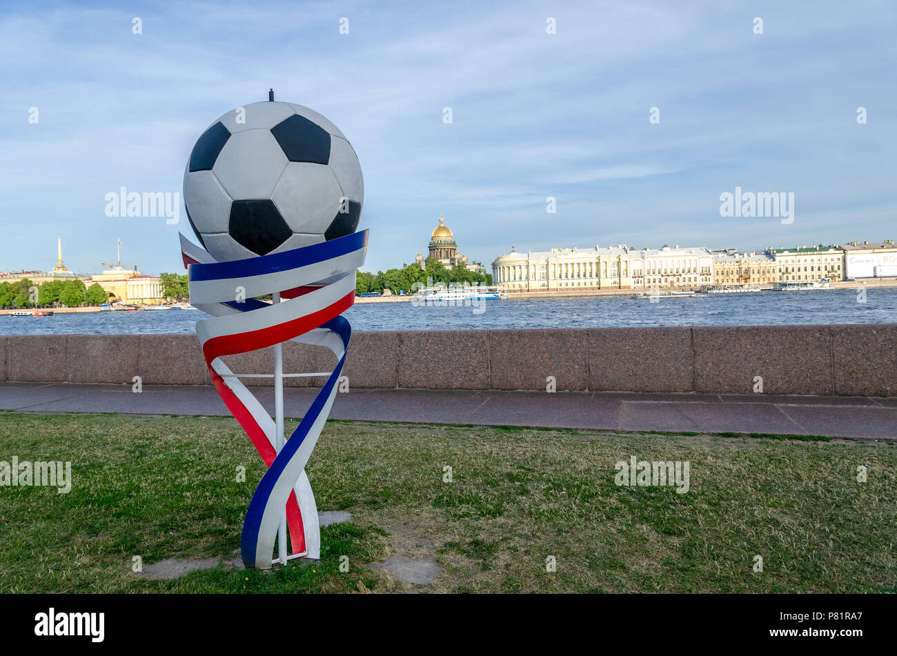 Football prop and Russian flag colours by the Neva river in St Petersburg to mark the FIFA World Cup 2018 held in the country. Stock Photo