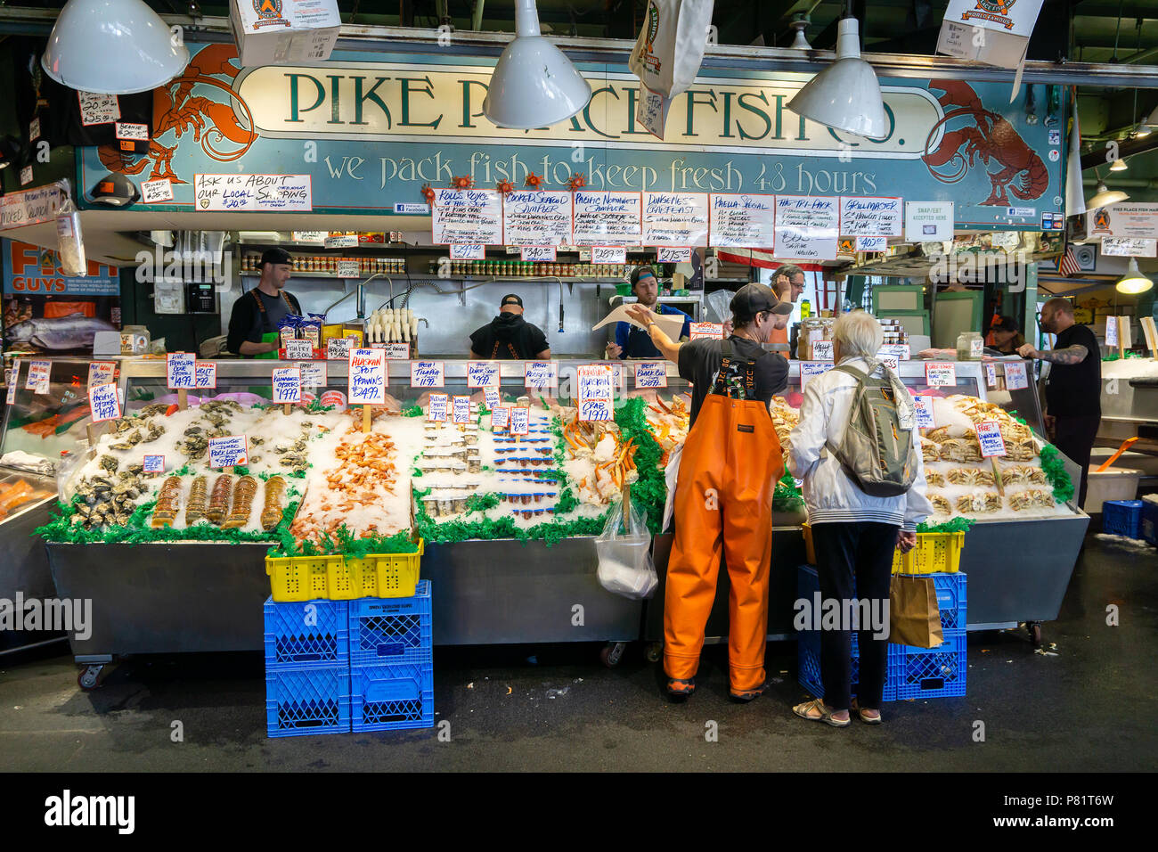 Fish merchants selling fish at Pike Place market, historic and iconic