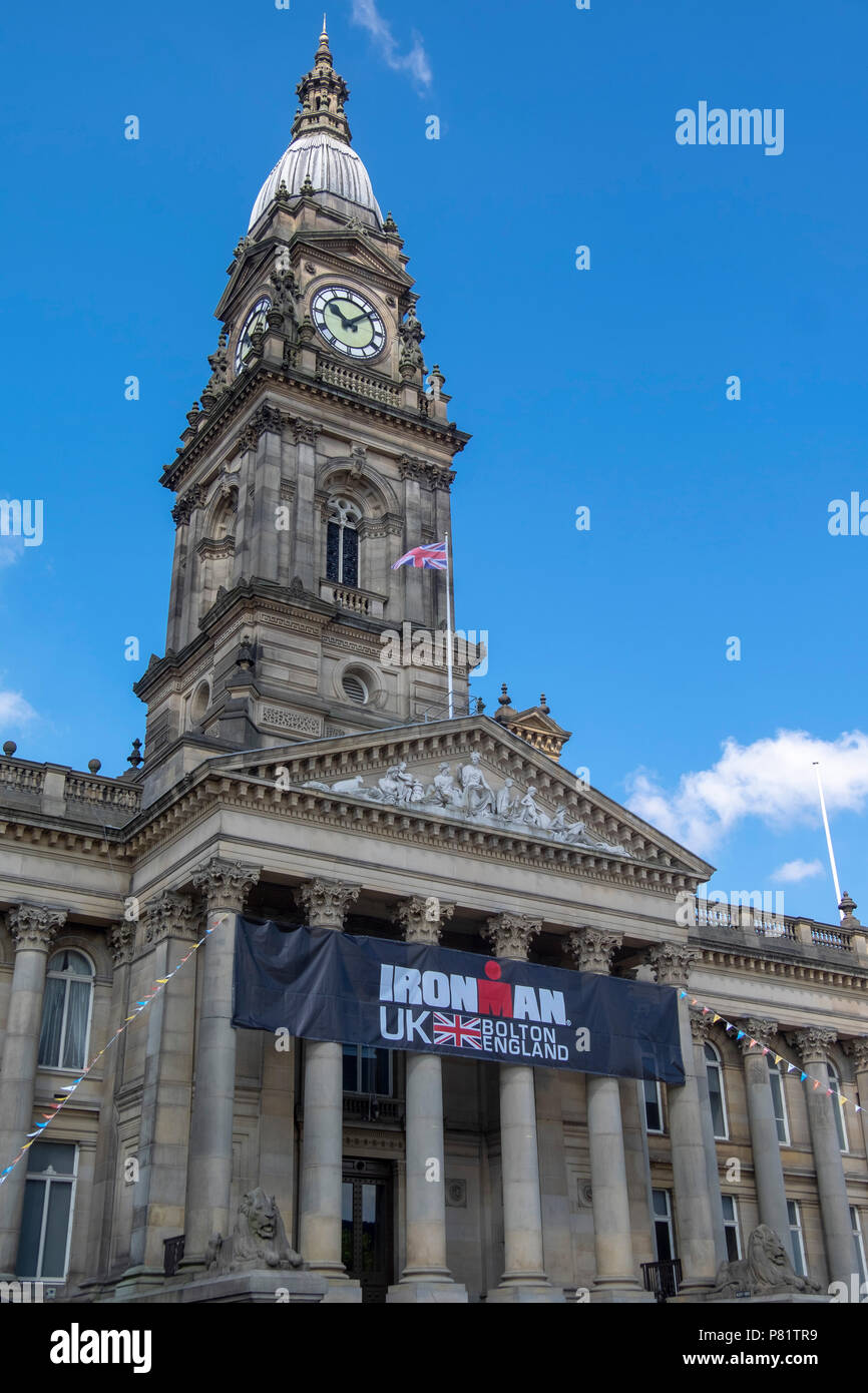 Clock tower of bolton town hall with blue sky Stock Photo