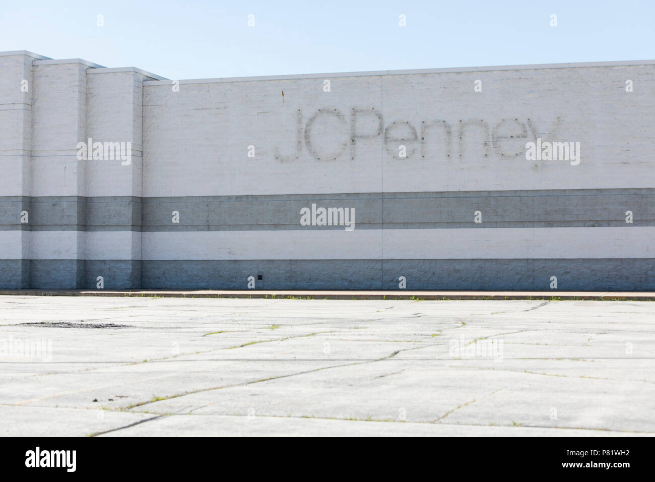 A logo sign outside of an abandoned JCPenney retail store in Oshkosh