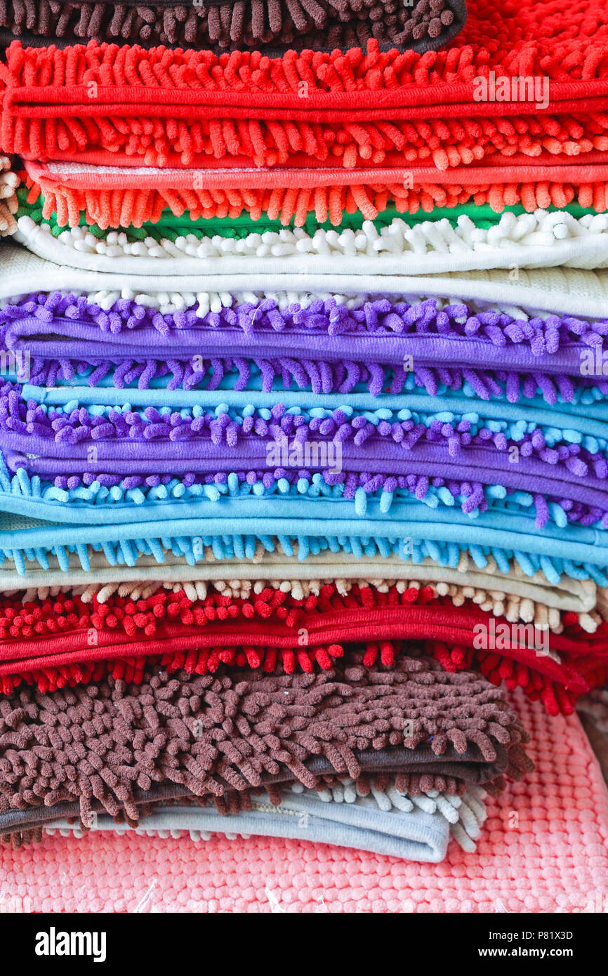 Pile of colorful bathroom floor mats and foot towels Stock Photo Alamy