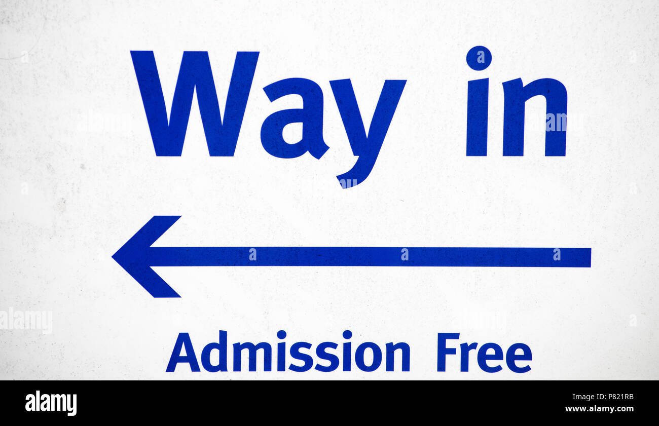 A blue arrow pointing the way into  the free admission UK Stock Photo