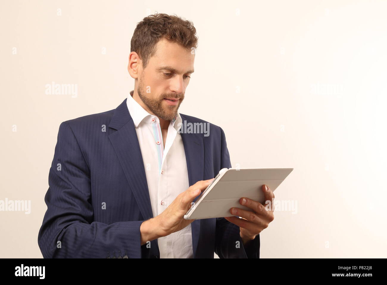 A Modern business man with tablet PC Stock Photo