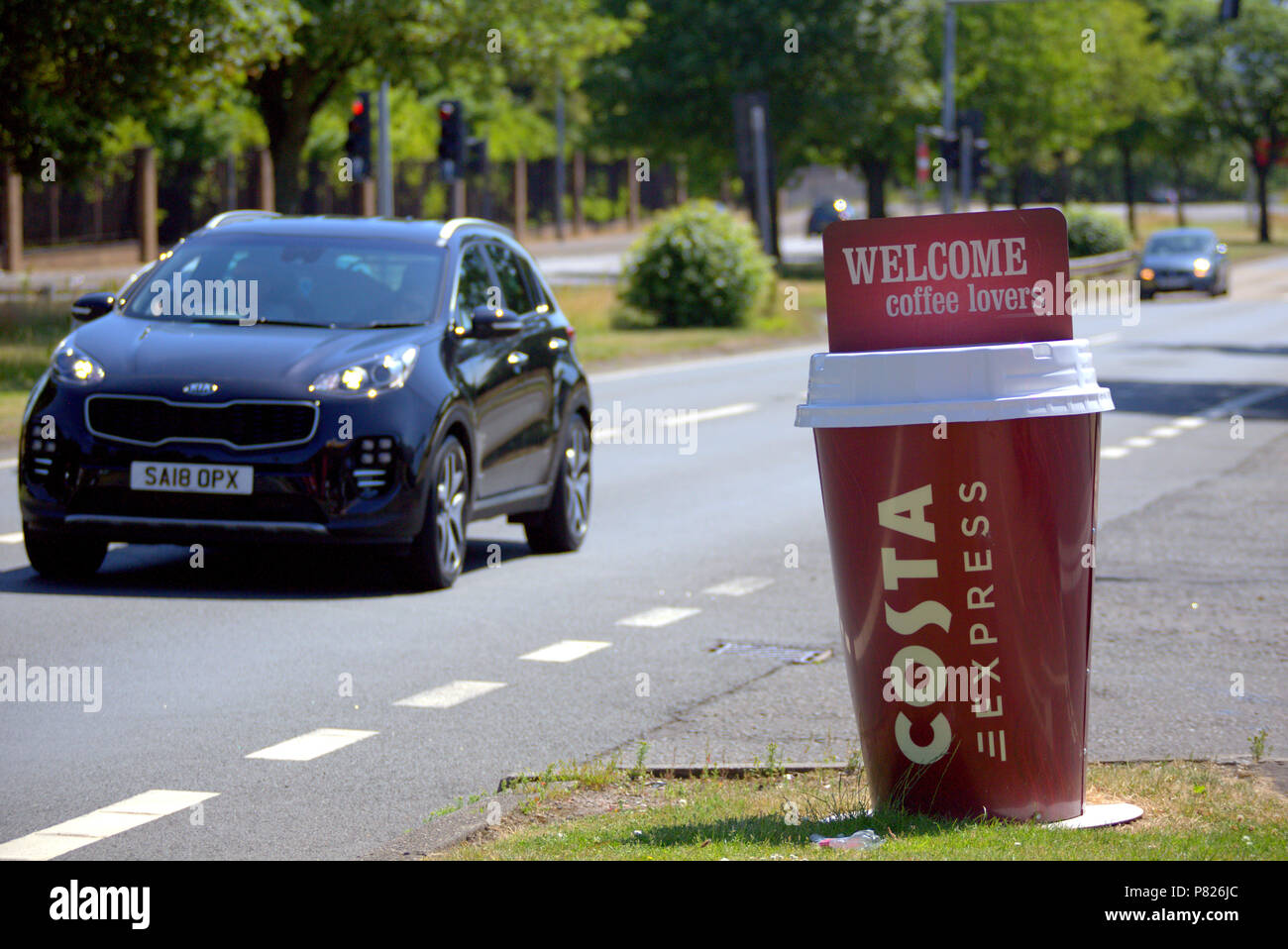 A82 A 82 costa coffee espresso giant coffee cup driving motorway road stop over falling asleep at the wheel Stock Photo