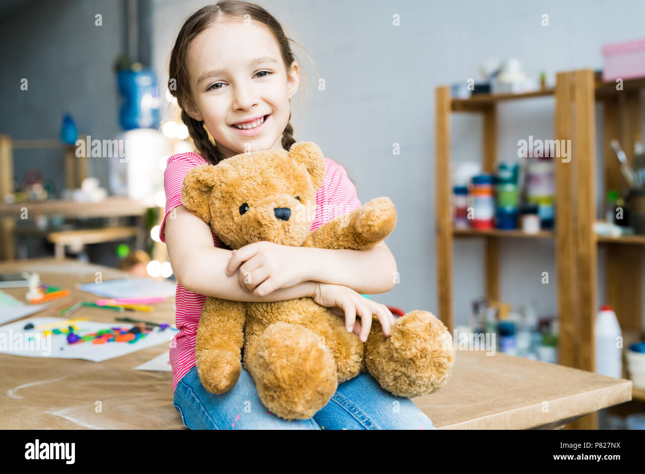 a girl with teddy
