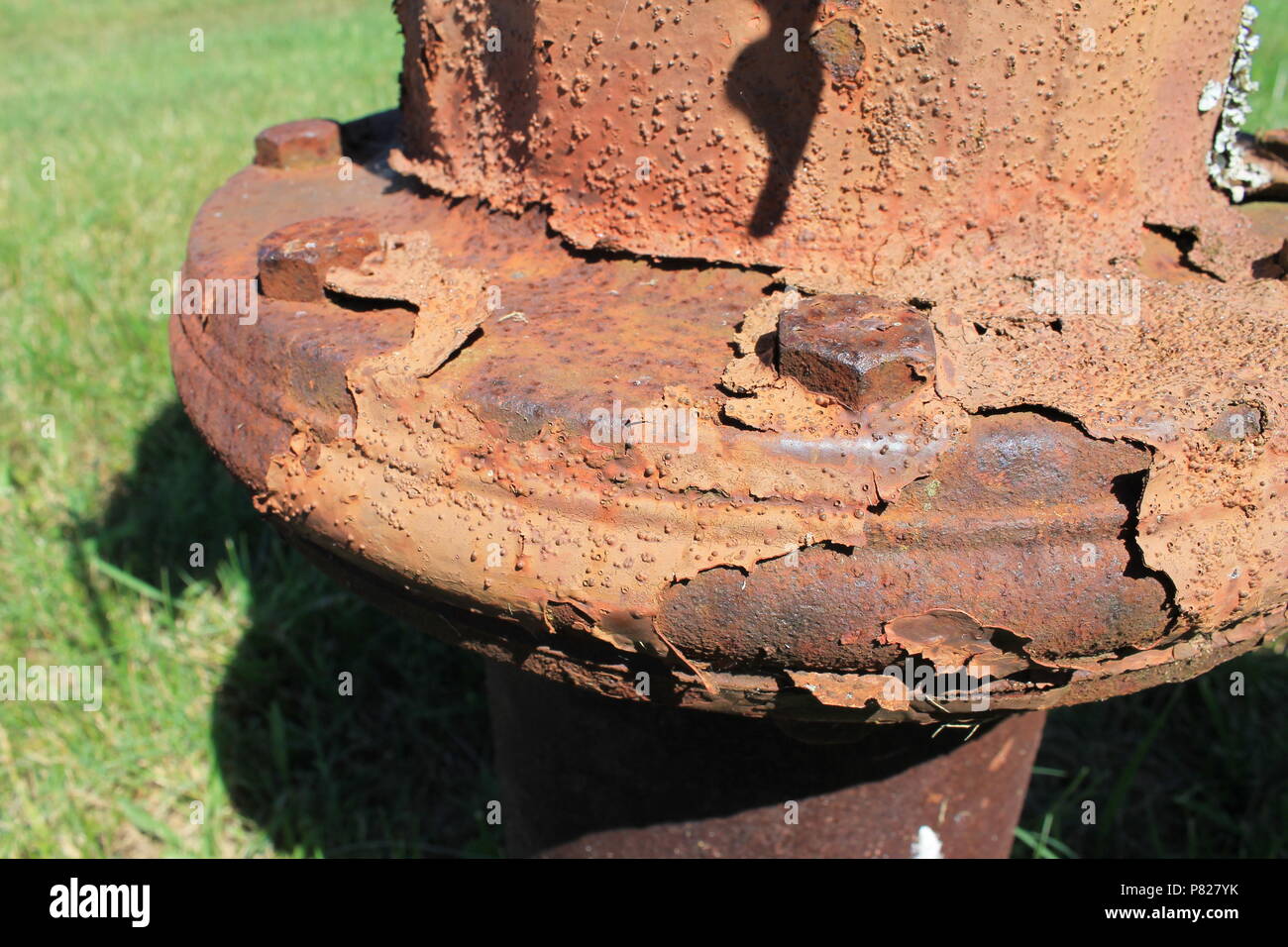 Flaking rust on an old fire hydrant. Stock Photo