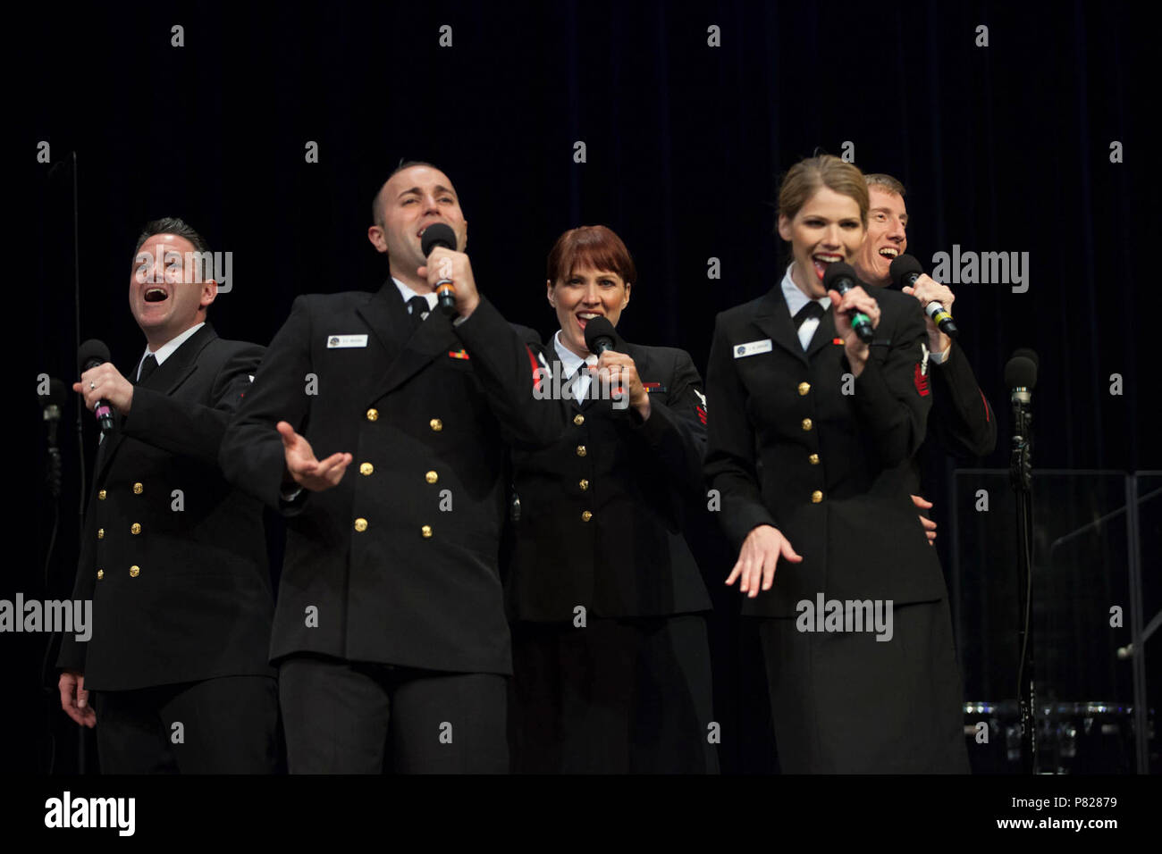 IPSWICH, MA (April 19, 2016) From the left, Musicians 1st Class Robert Kurth, Dennys Moura, Maia Rodriguez, Chelsi Ervien and Adam Whitman perform a rendtion of 'Rather Be' during a concert at the  Ipswich Performing Arts Center. The Sea Chanters are on a 22-day tour of the northeastern United States. Stock Photo