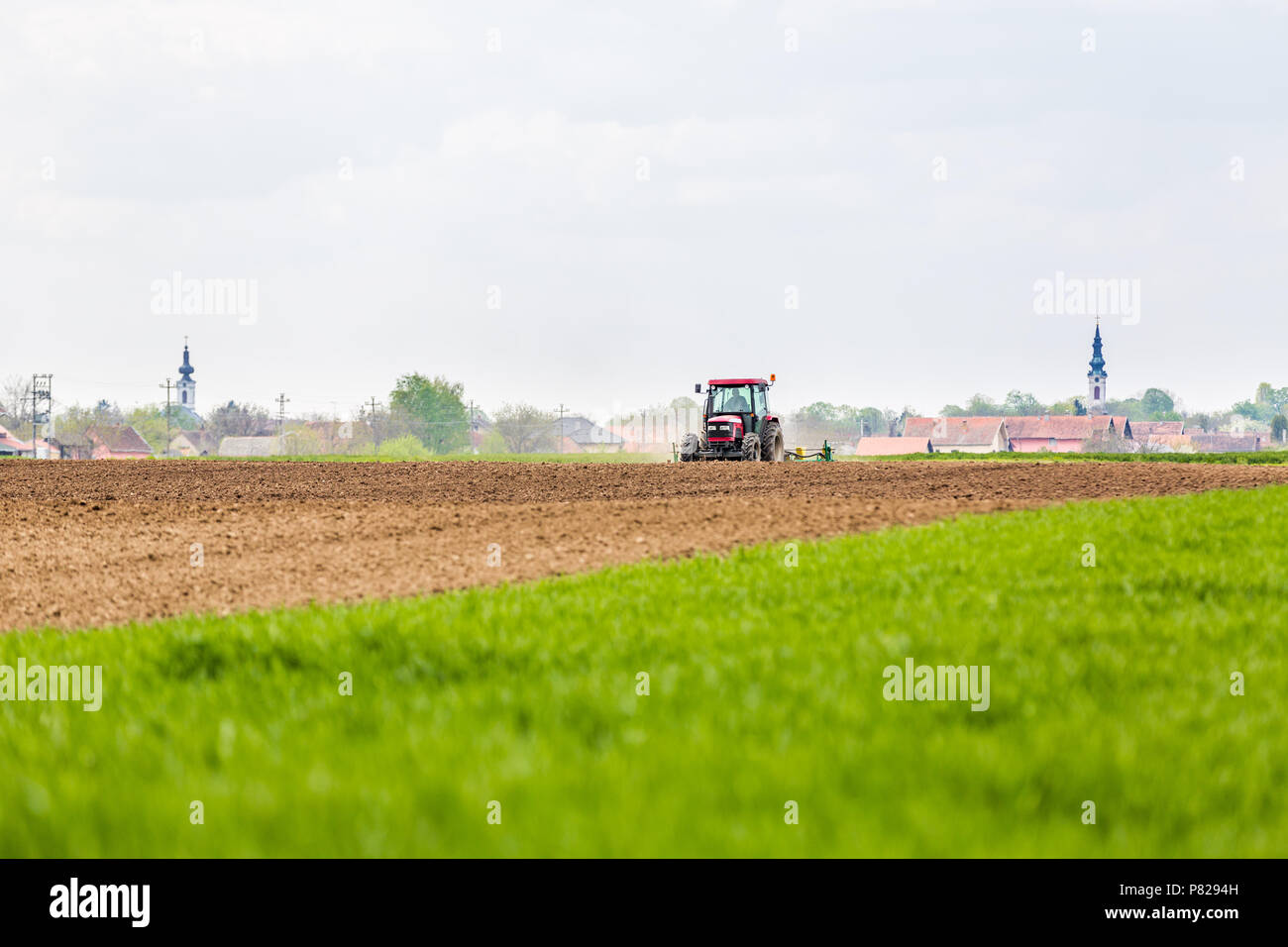 Farmer seeding, sowing crops at field. Sowing is the process of ...
