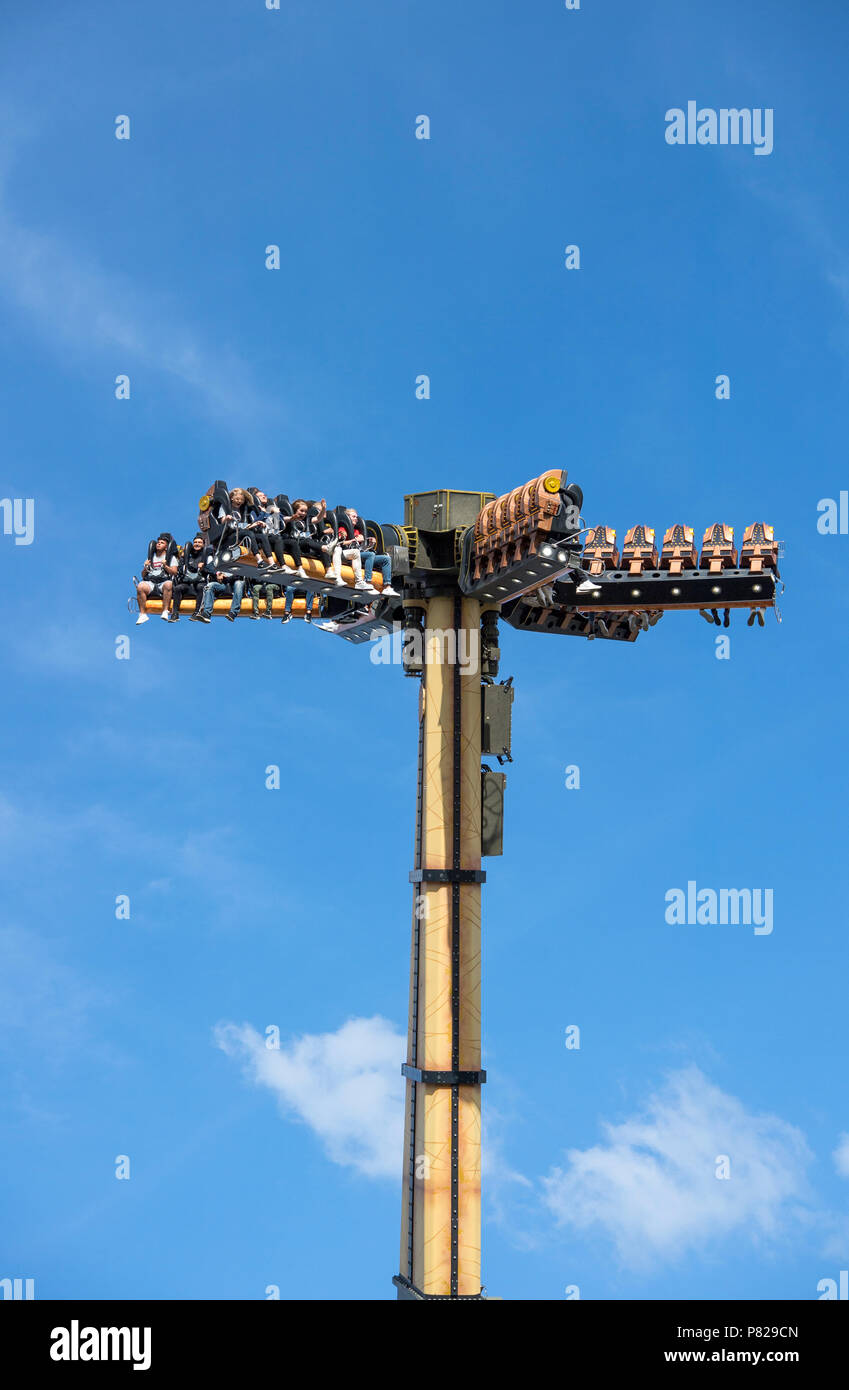 People enjoying a ride on one of the white knuckle attractions at the Liseberg amusement park in the center of Gothenburg, Sweden Stock Photo