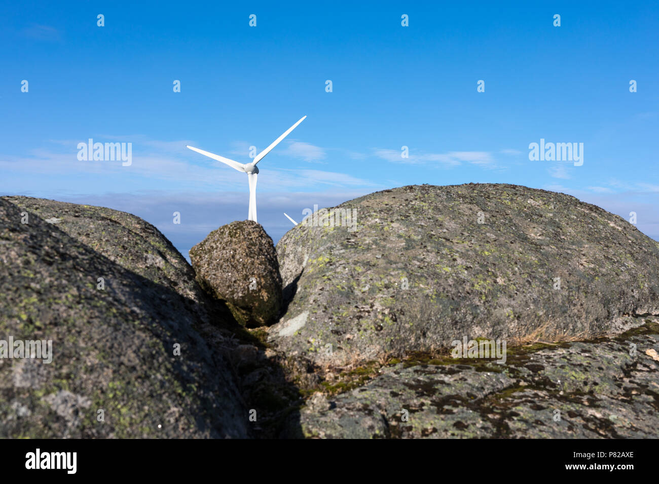 Wind energy turbines, in a landscpae over a beautiful blue sky Stock ...