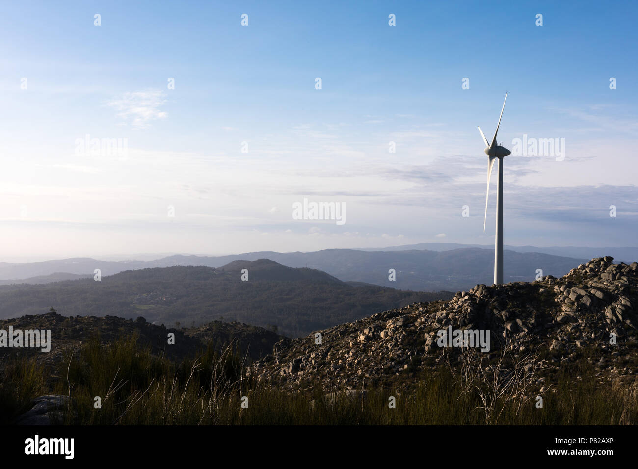 Wind energy turbines, in a landscpae over a beautiful blue sky Stock ...