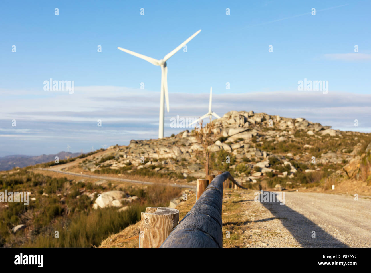 Wind energy turbines, in a landscpae over a beautiful blue sky Stock ...
