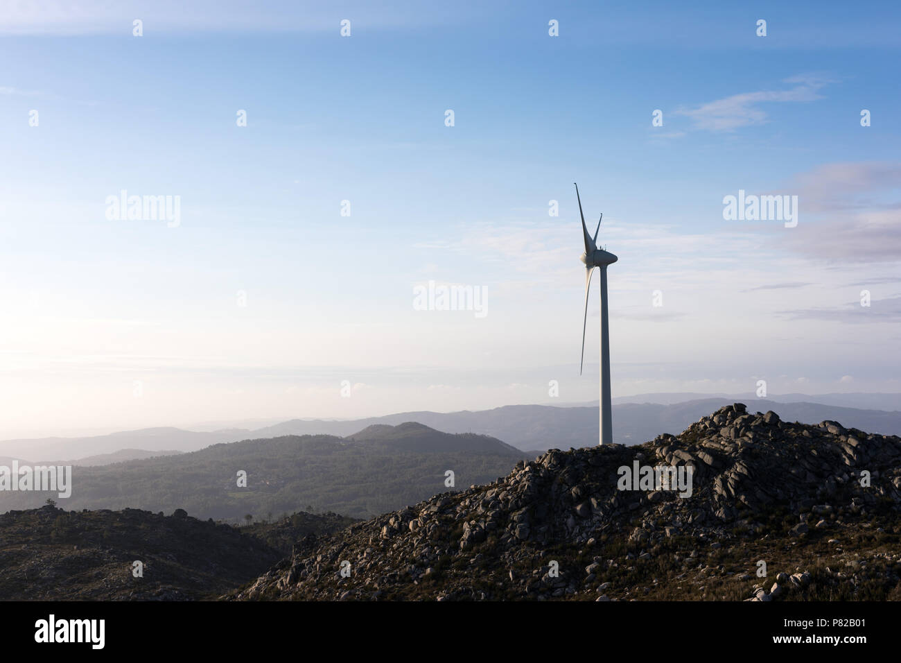 Wind energy turbines, in a landscpae over a beautiful blue sky Stock ...