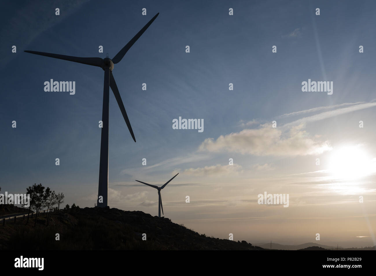 Wind energy turbines, in a landscpae over a beautiful blue sky Stock ...