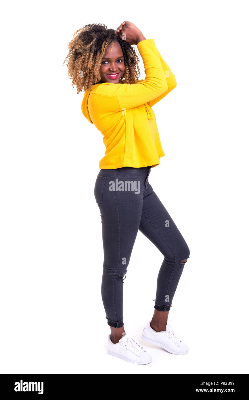 Studio shot of a Very Happy african woman with arms raised Stock Photo ...