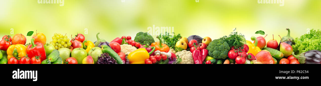 Panoramic wide photo healthy and useful vegetables and fruits isolated on white background. Assortment fresh products - apples, bananas, grapes, pears Stock Photo