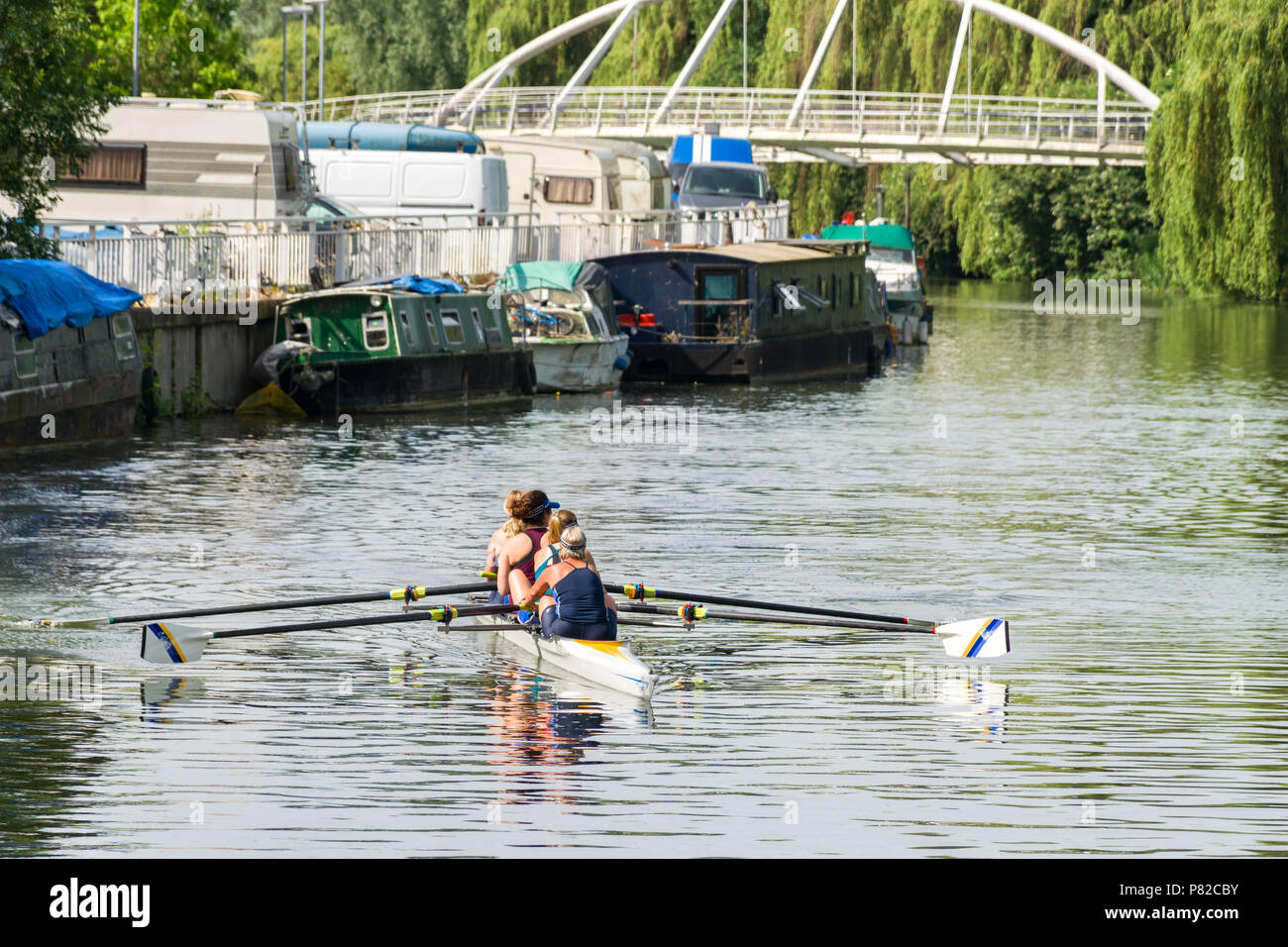 Women rowing on the river Cam on a sunny Summer day, Cambridge, UK Stock Photo