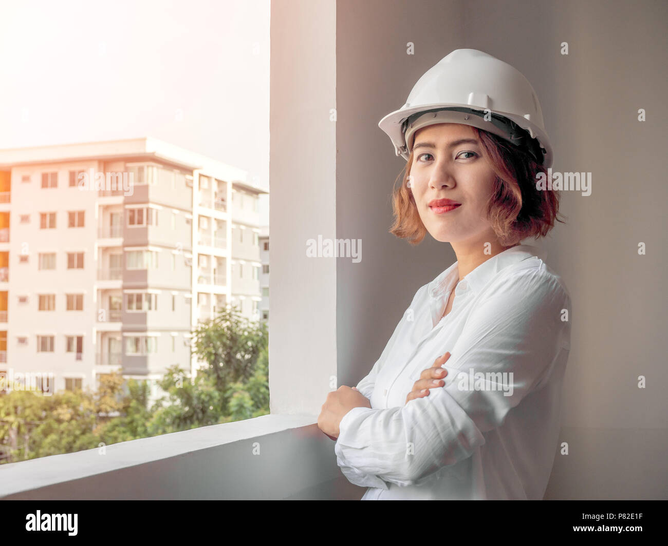 Beautiful Asian Woman Engineer Curly Short Hair Wearing White